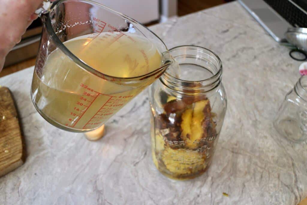 pour sugar water over pineapple scraps