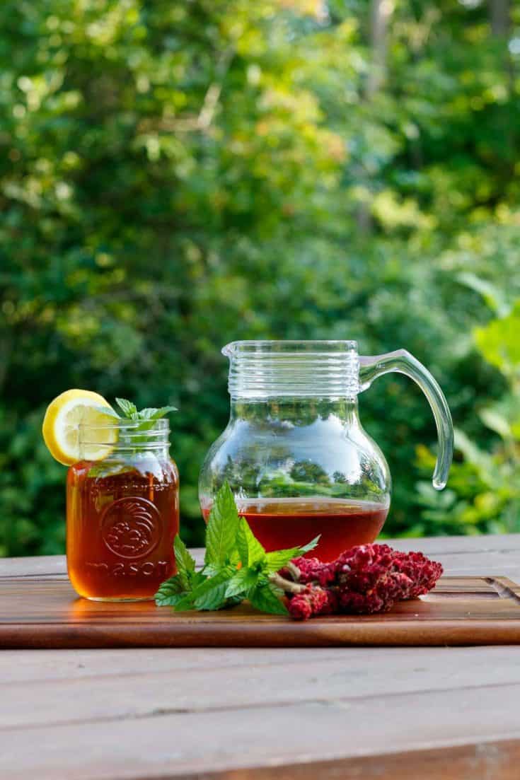 sumac lemonade with a glass pitcher